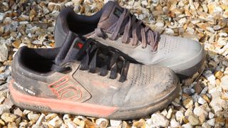 An odd pair of muddy MTB shoes