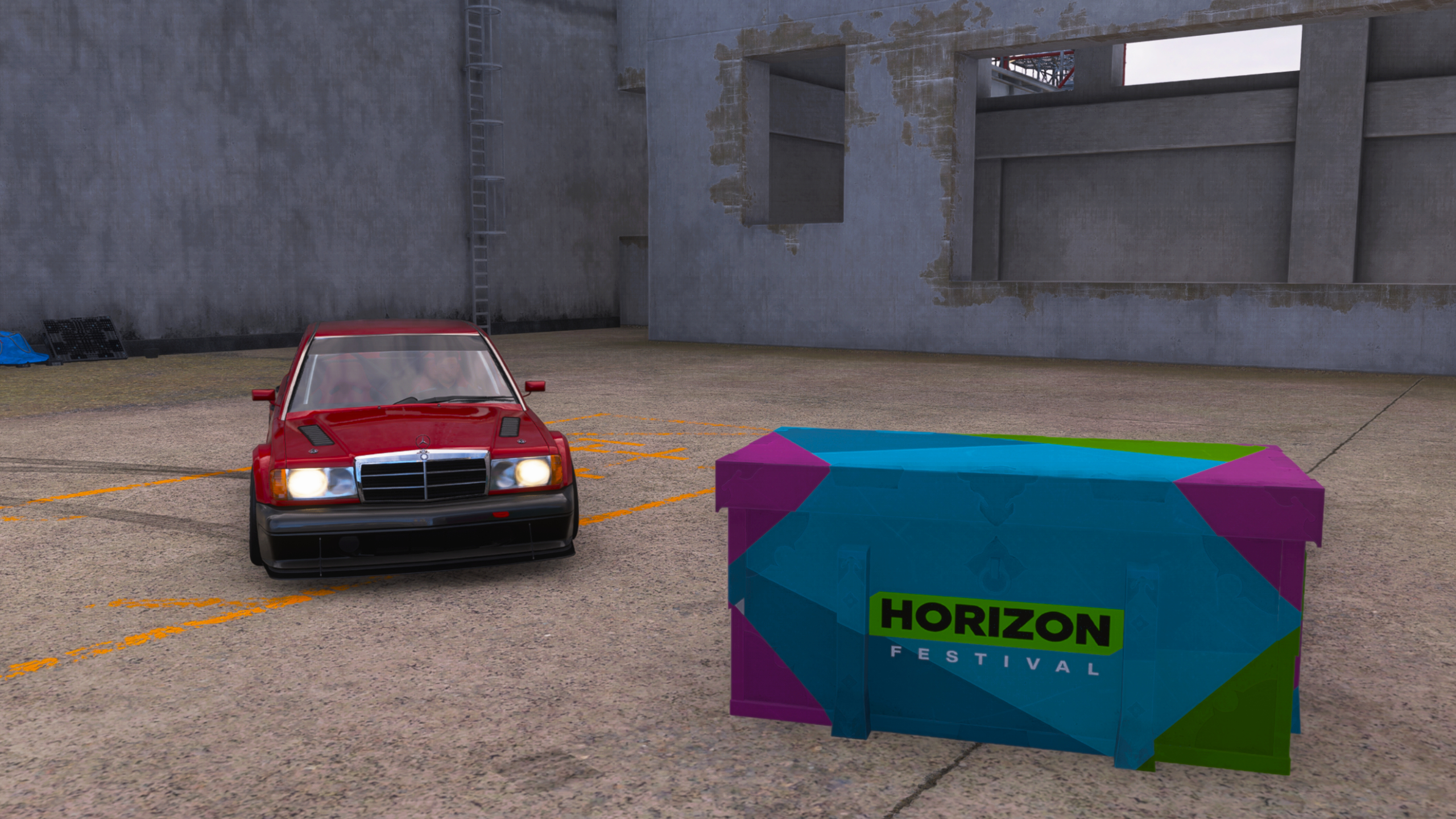 Forza Horizon 6 Nangan Treasure Hunt: A front-on view of a red car parked next to a colourful treasure chest at Irokawa Space Center.