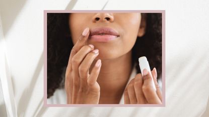 A close up of a woman holding a lip balm and applying it to her lips with her finger/ in a pink and cream template