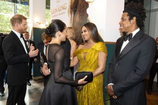 Prince Harry, Duke of Sussex (L) and Meghan, Duchess of Sussex (2nd L) meets cast and crew, including Beyonce Knowles-Carter (C) Jay-Z (R) as they attend the European Premiere of Disney's "The Lion King" at Odeon Luxe Leicester Square on July 14, 2019 in London, England.