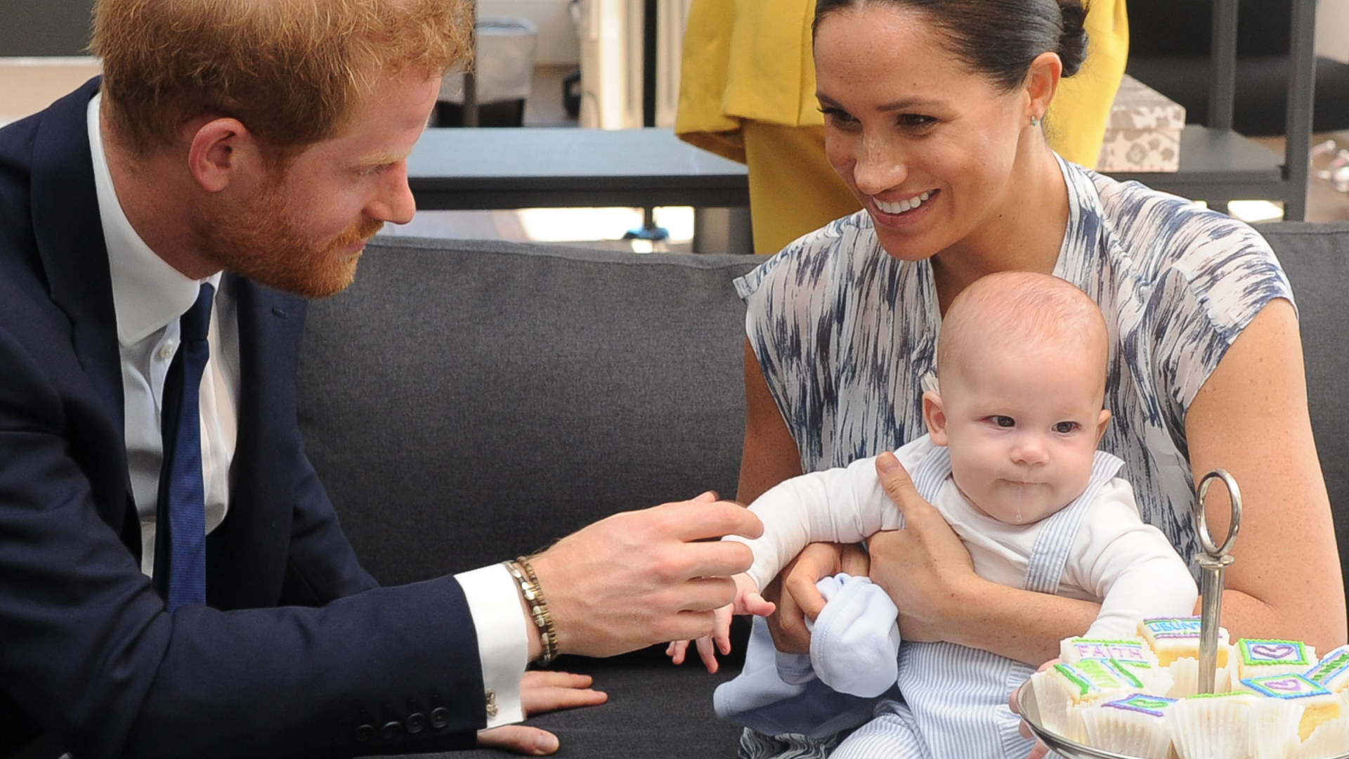 Meghan Markle cradles Prince Archie while Prince Harry fusses over him