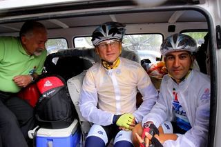Andrey Mizurov (Tabriz) takes some shelter from the storm before the start of stage 2.