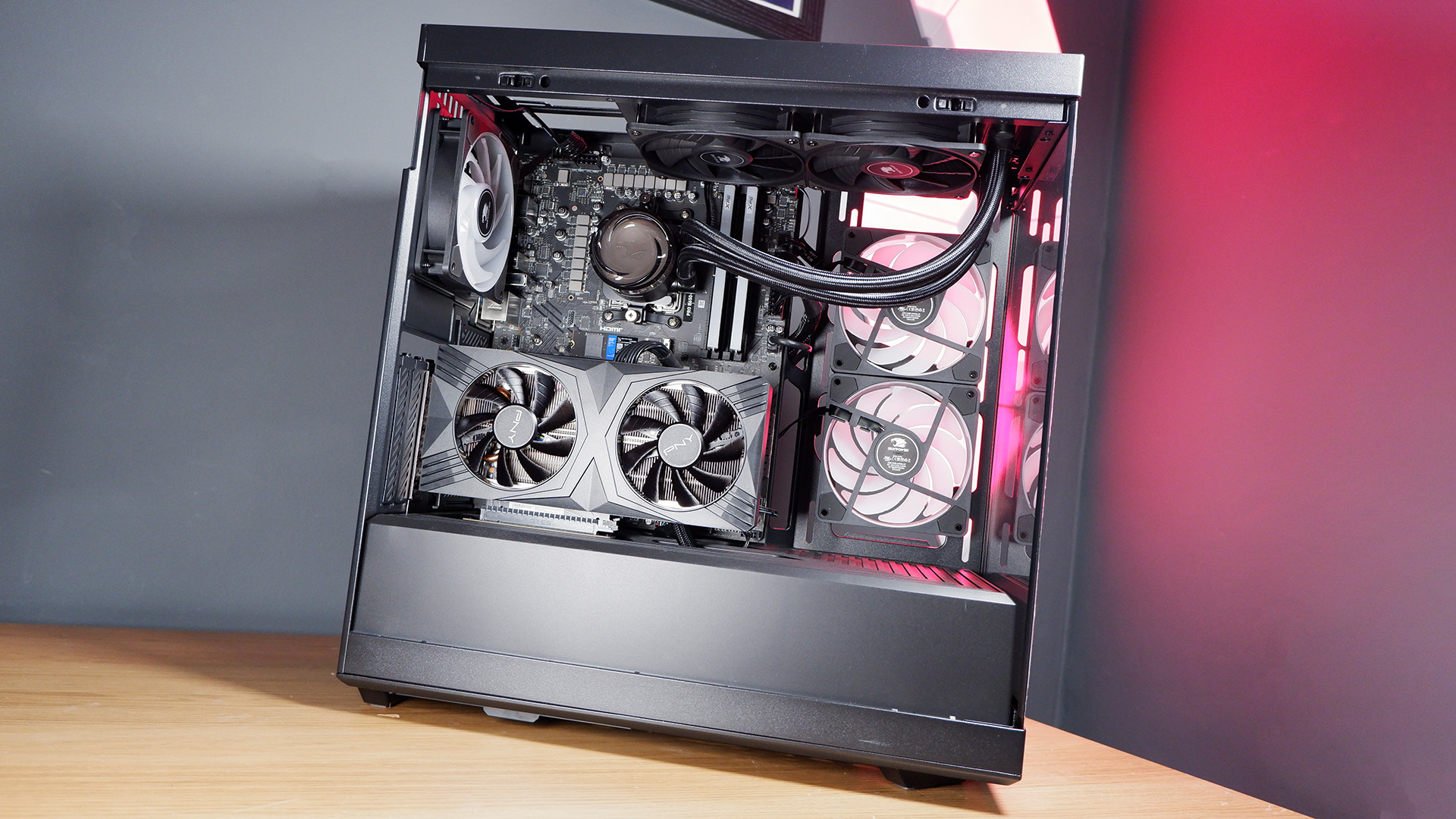 An iBuyPower gaming PC being set up on a desktop.