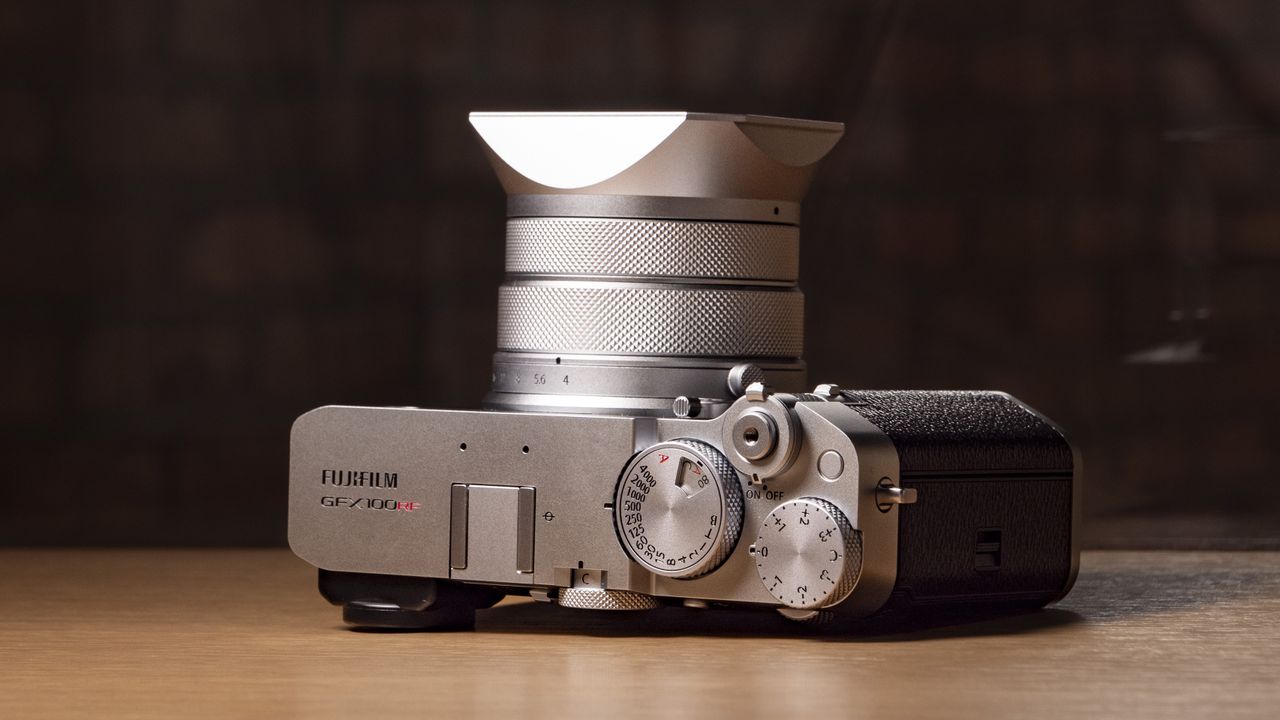 Fujifilm GFX100 RF medium-format compact camera on a wooden table