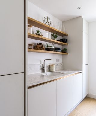white utility room with white worksurface