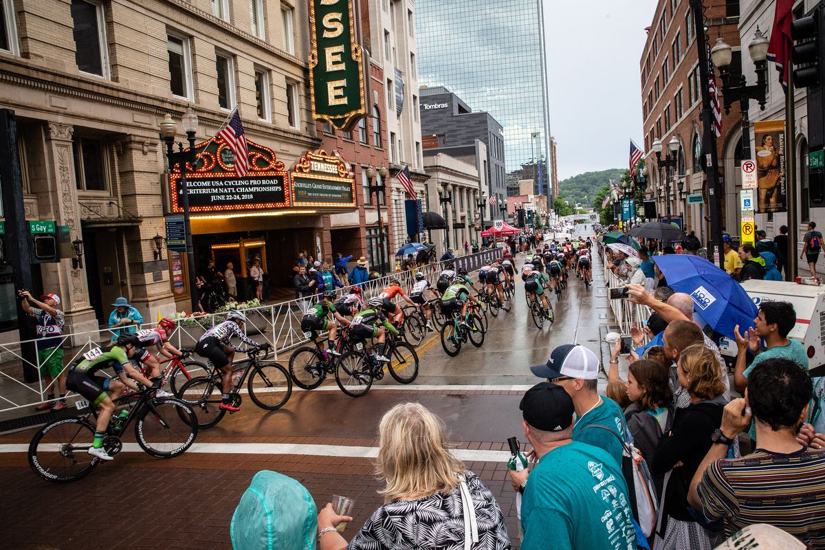 The peloton takes a corner in the rain during the US Pro Criterium