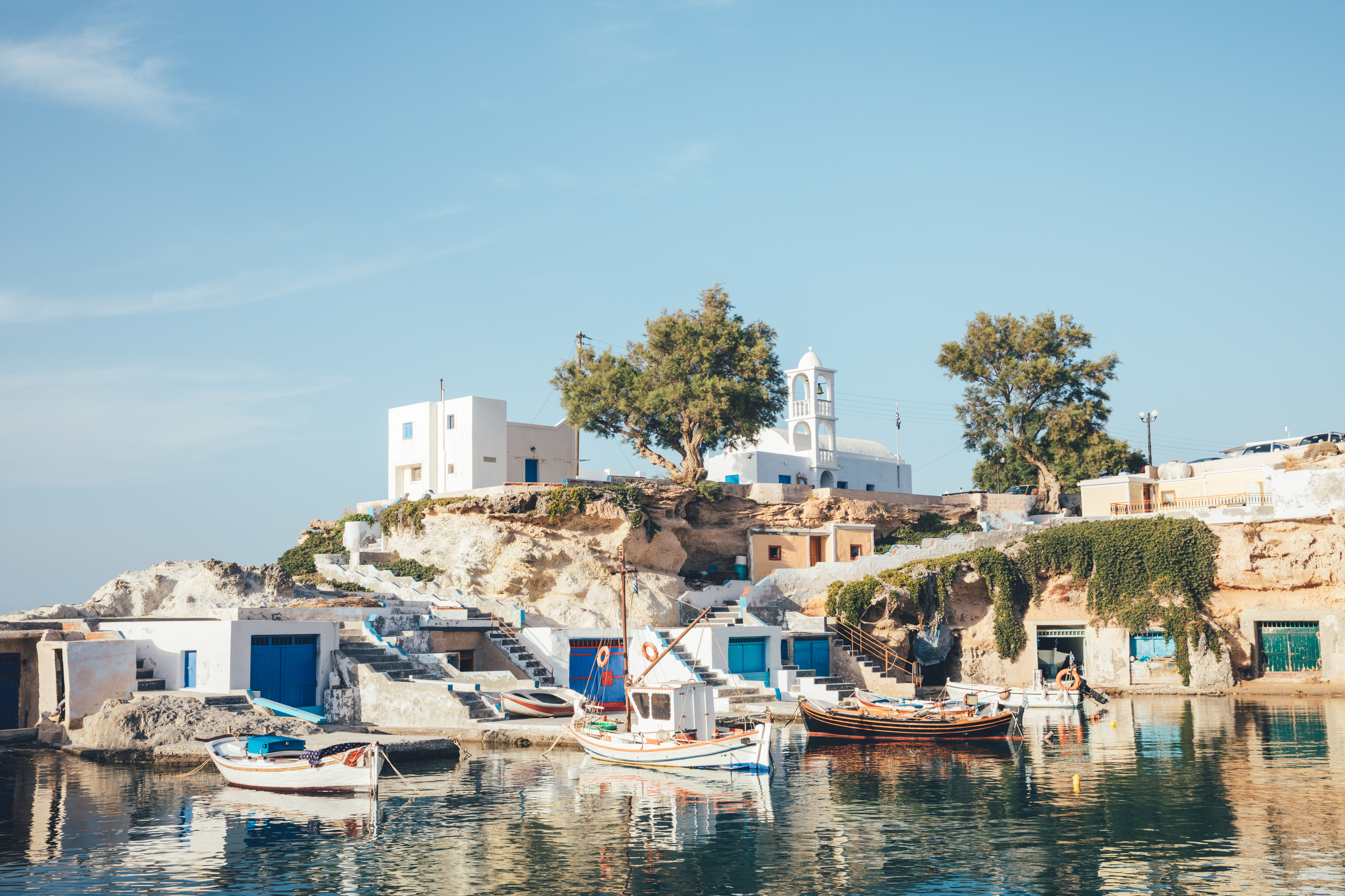 Traditional Greek fisherman&#039;s homes clustered around a small harbour