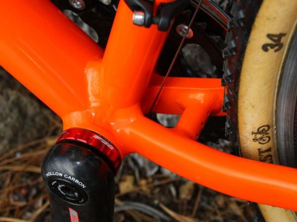 The driveside chain stay is tubular throughout its length but the driveside one uses a short machined aluminum section for better chainring and tire clearance.