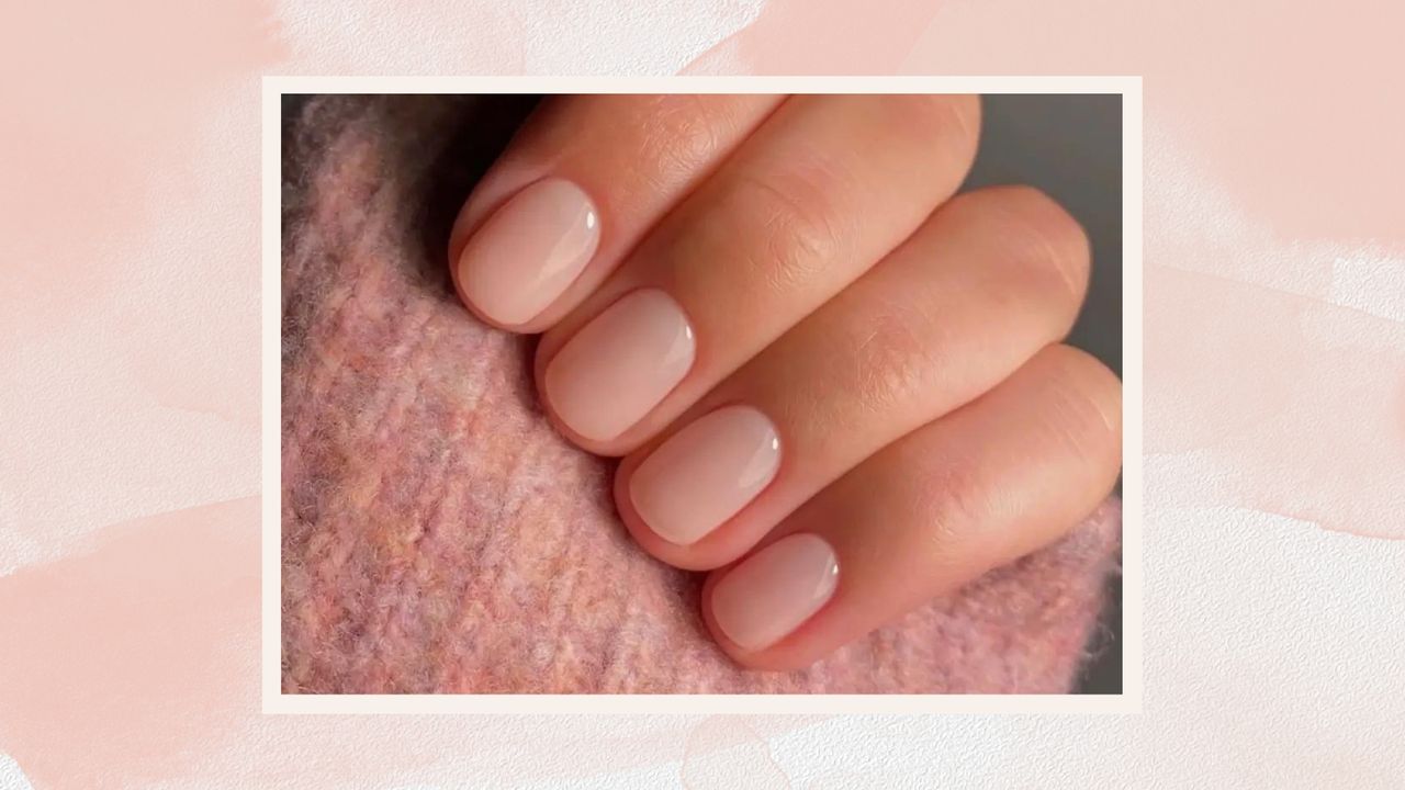 A close up of a hand with a milky pink manicure by nail artist @matejanova/Mateja Novakovic/ in a pink watercolour template