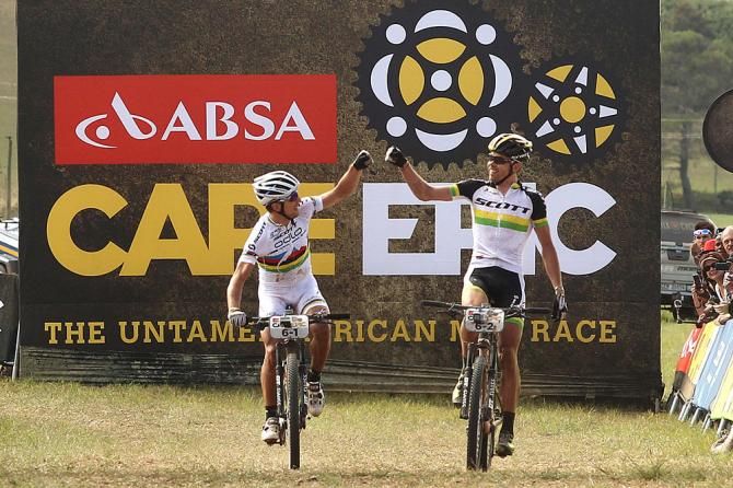 Nino Schurter and Philip Buys of SCOTT-Odlo MTB Racing celebrate as they win the 4th stage