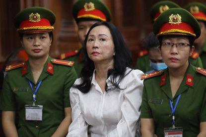 Vietnamese property tycoon Truong My Lan (C) looks on at a court in Ho Chi Minh city