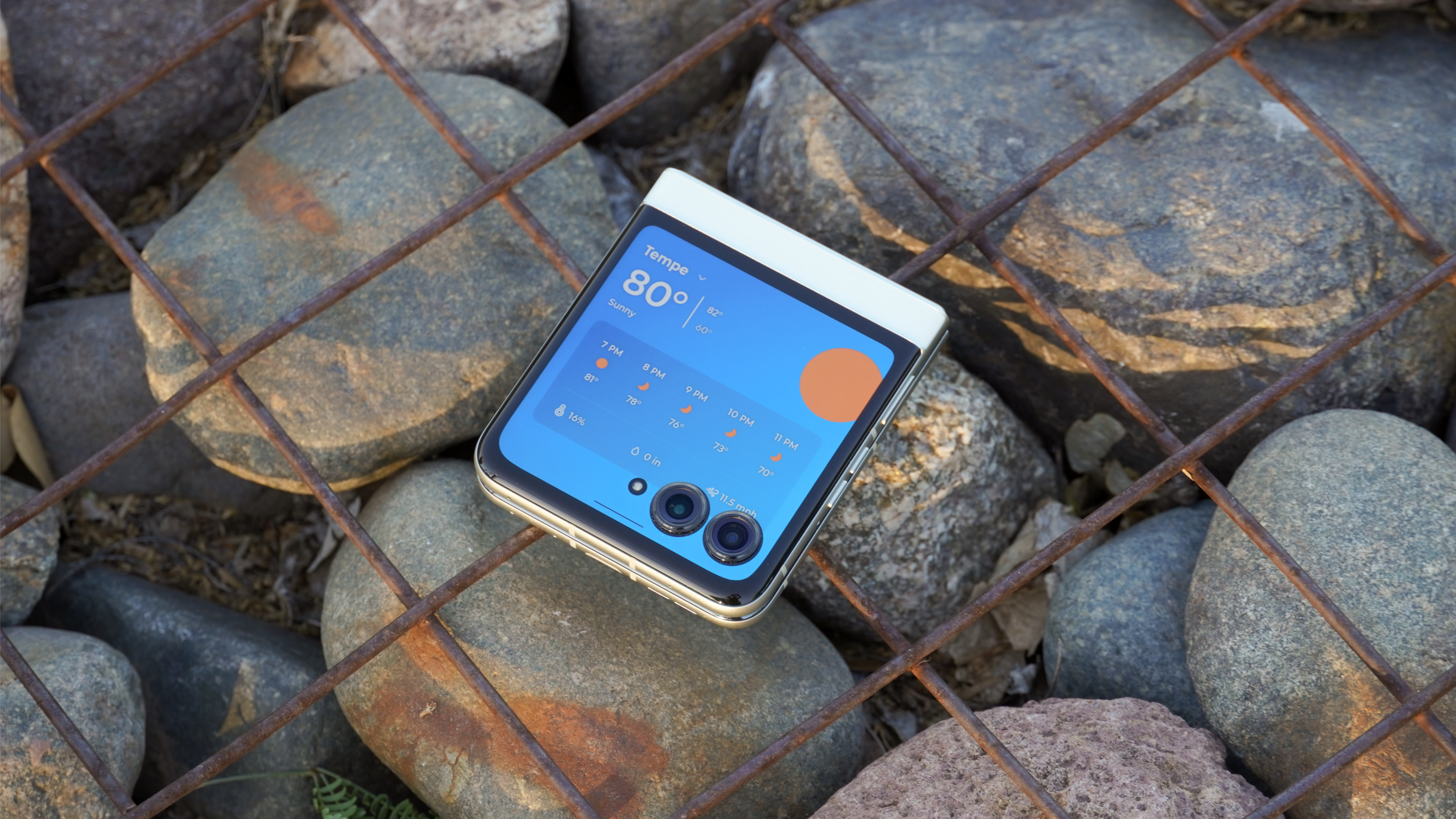 The Motorola Razr 2025 with the Weather panel on the cover screen.