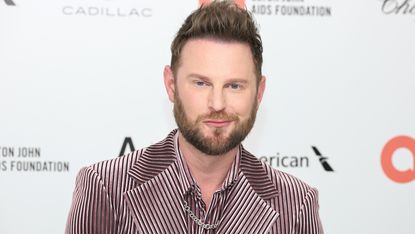 Bobby Berk at an event in a pinkish suit