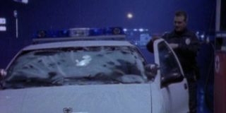 A police officer reacts to the goo on his windshield on Unsolved Mysteries
