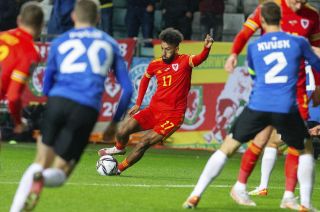 Sorba Thomas, centre, controls the ball during the clash against Estonia