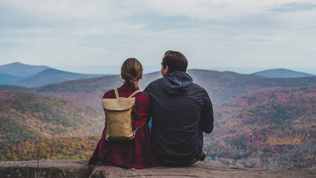 A couple of hikers take in a view.