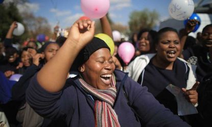 Thousands of people celebrate the 95th birthday of Nelson Mandela outside the Mediclinic Heart Hospital where he is being treated on July 18 in Pretoria, South Africa.