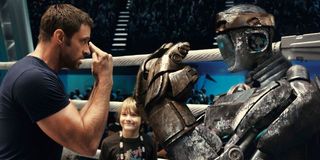 Hugh Jackman locks eyes with Atom in the ring in Real Steel.