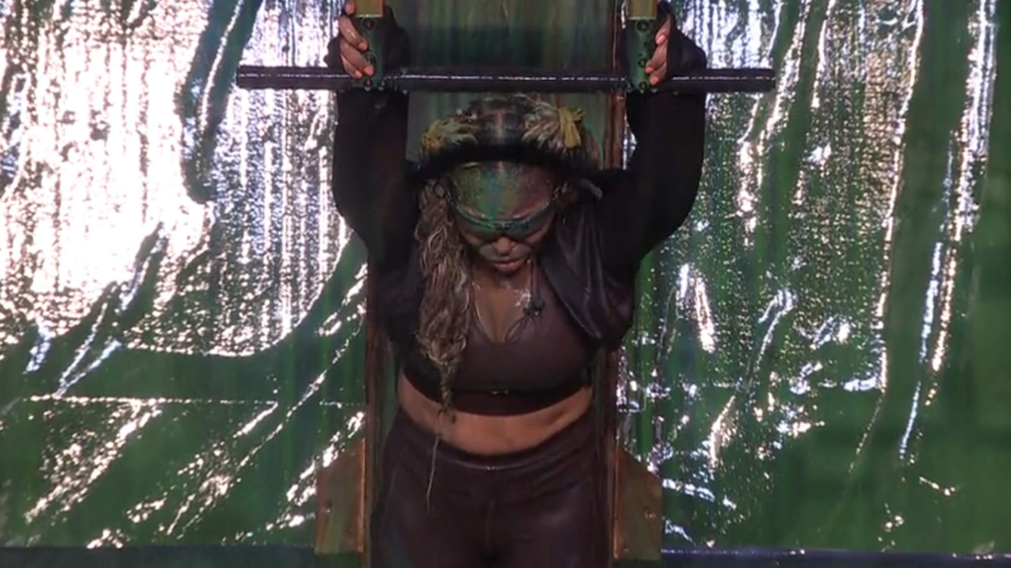 LaTrice hanging forward on the wall in Big Brother season 28