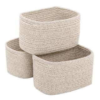 Three small Cotton Rope Storage Baskets in beige. Stacked in a 2 by 1 pyramid