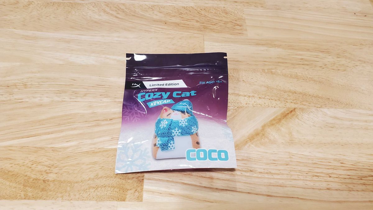 a package of a a small cat shaped keycap
