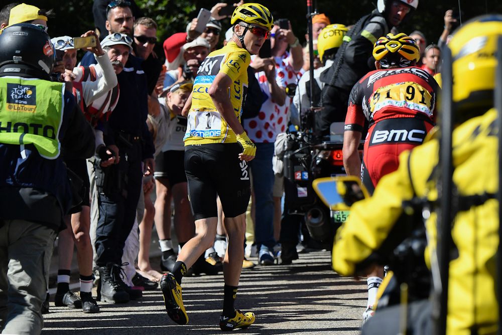 Chris Froome runs toward the finish of stage 12 at the Tour de France