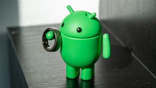 The Amazfit Helio Ring on the Android Bot figure