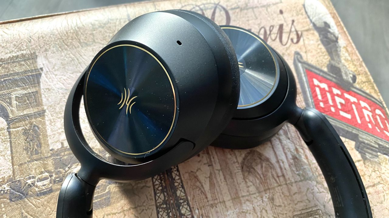 Earcups of the OneOdio Focus A6 over-ear heaphones on a Parisian stool