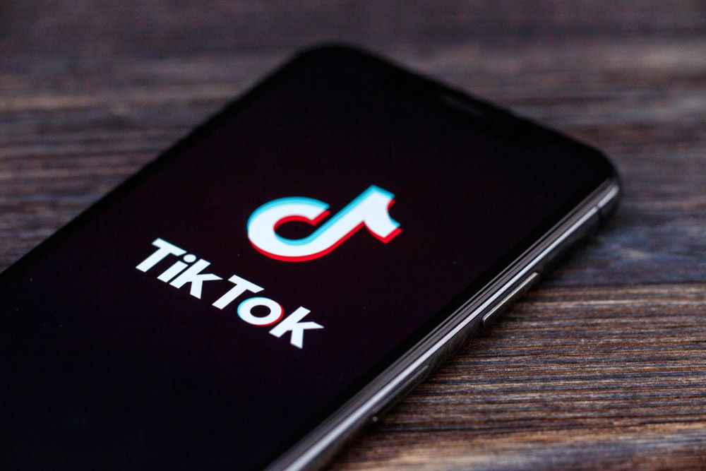 TikTok logo displayed on an iPhone.