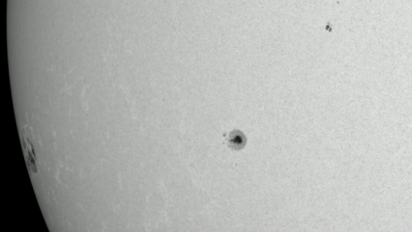 gif animation showing the giant sunspot coming into view. The sunspot group is more than 15 times the diameter of Earth.