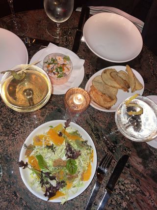 plates of food and cocktails at The Golden Swan in New York
