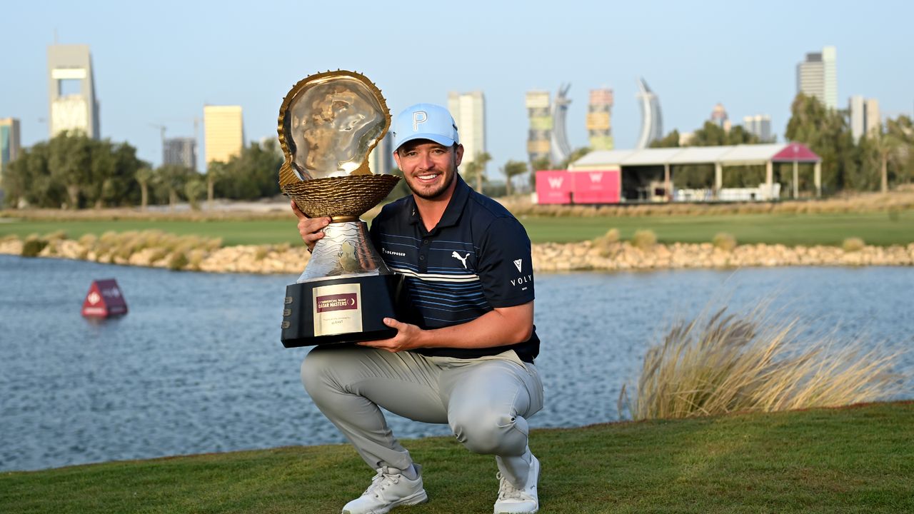 Ewen Ferguson with the Commercial Bank Qatar Masters after his 2022 win