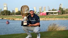 Ewen Ferguson with the Commercial Bank Qatar Masters after his 2022 win