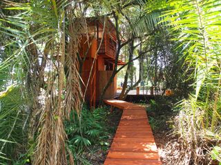 approach to cabin by Atelier Tropical