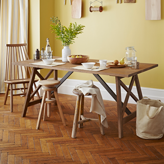 dining room with dining table and stools and retro parquet