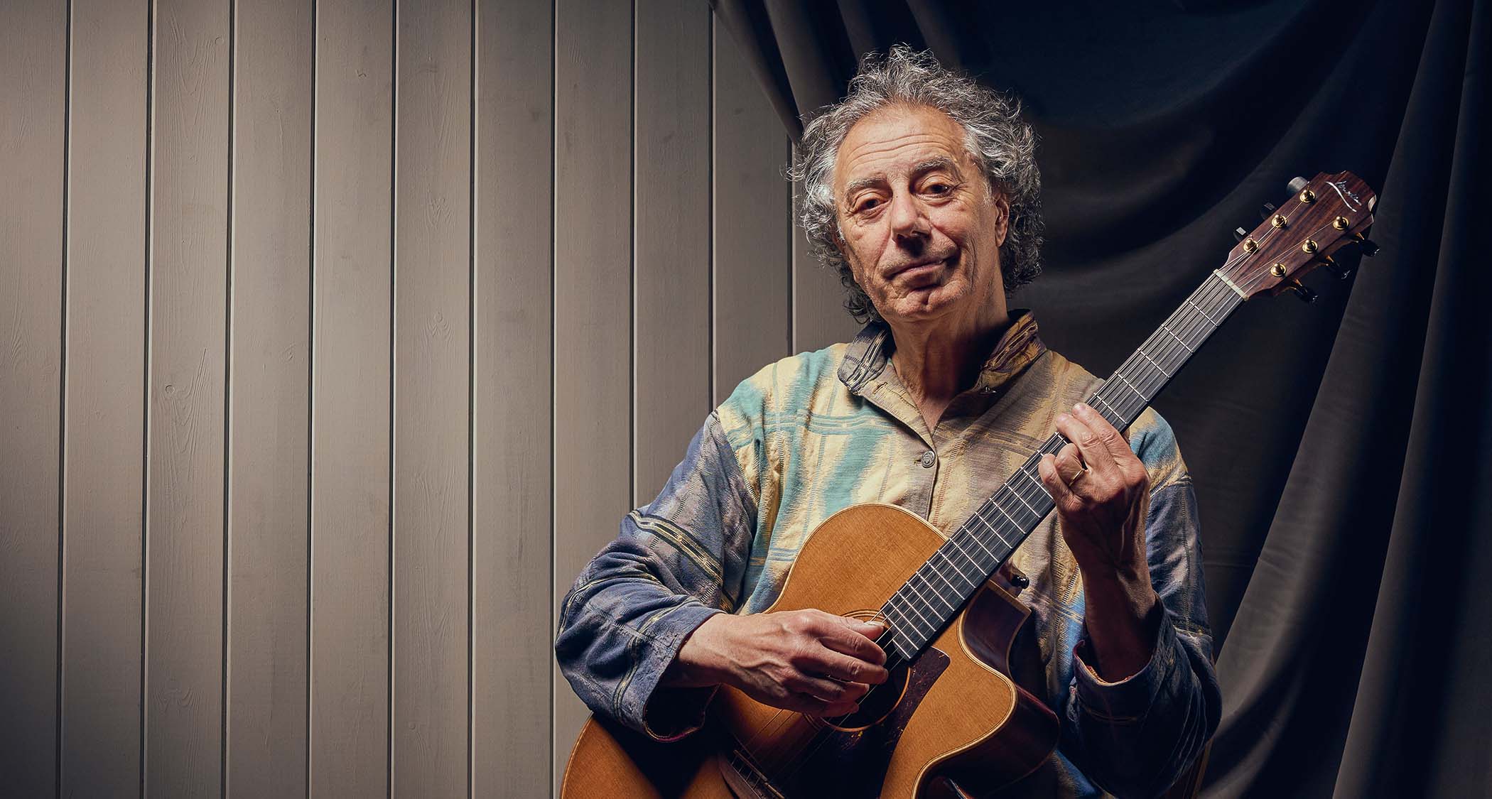 Pierre Bensusan is photographed with his beloved Lowden acoustic
