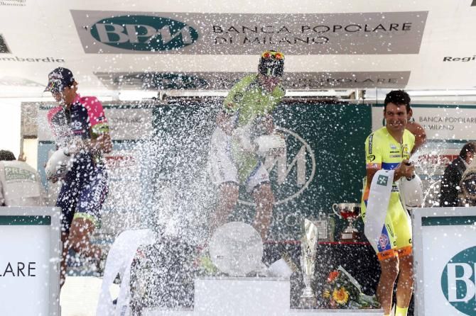 Elia Viviani, Filippo Pozzato and Simone Ponzi celebrate on the podium of the Coppa Bernocchi.