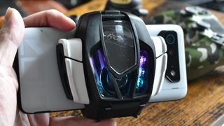 Asus ROG Phone 7 Ultimate with AeroActive Cooler in hand