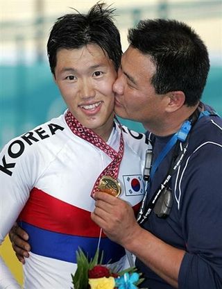 South Korea's Jang Sun Jae gets a kiss ©: AFP