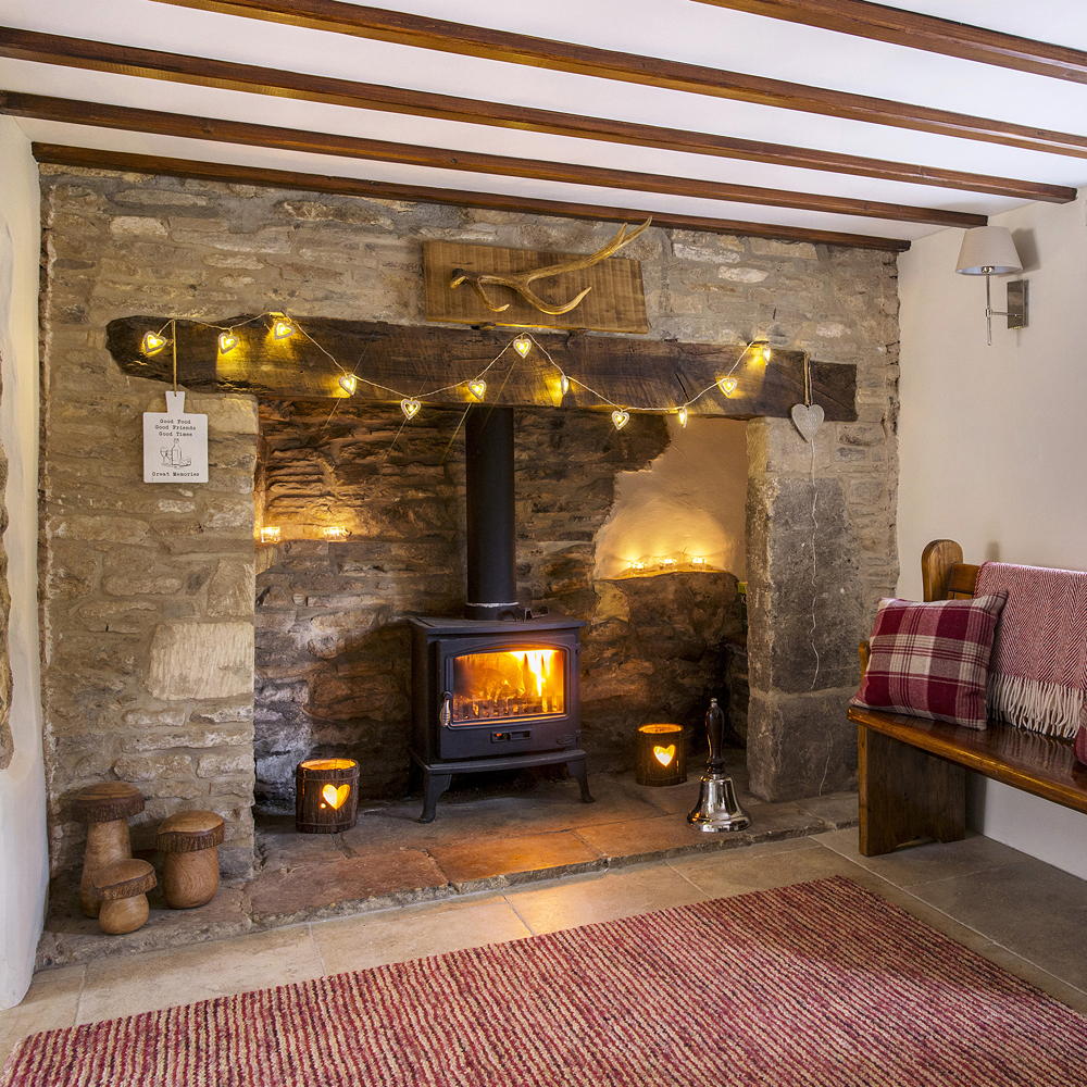 living room with fire place and bench