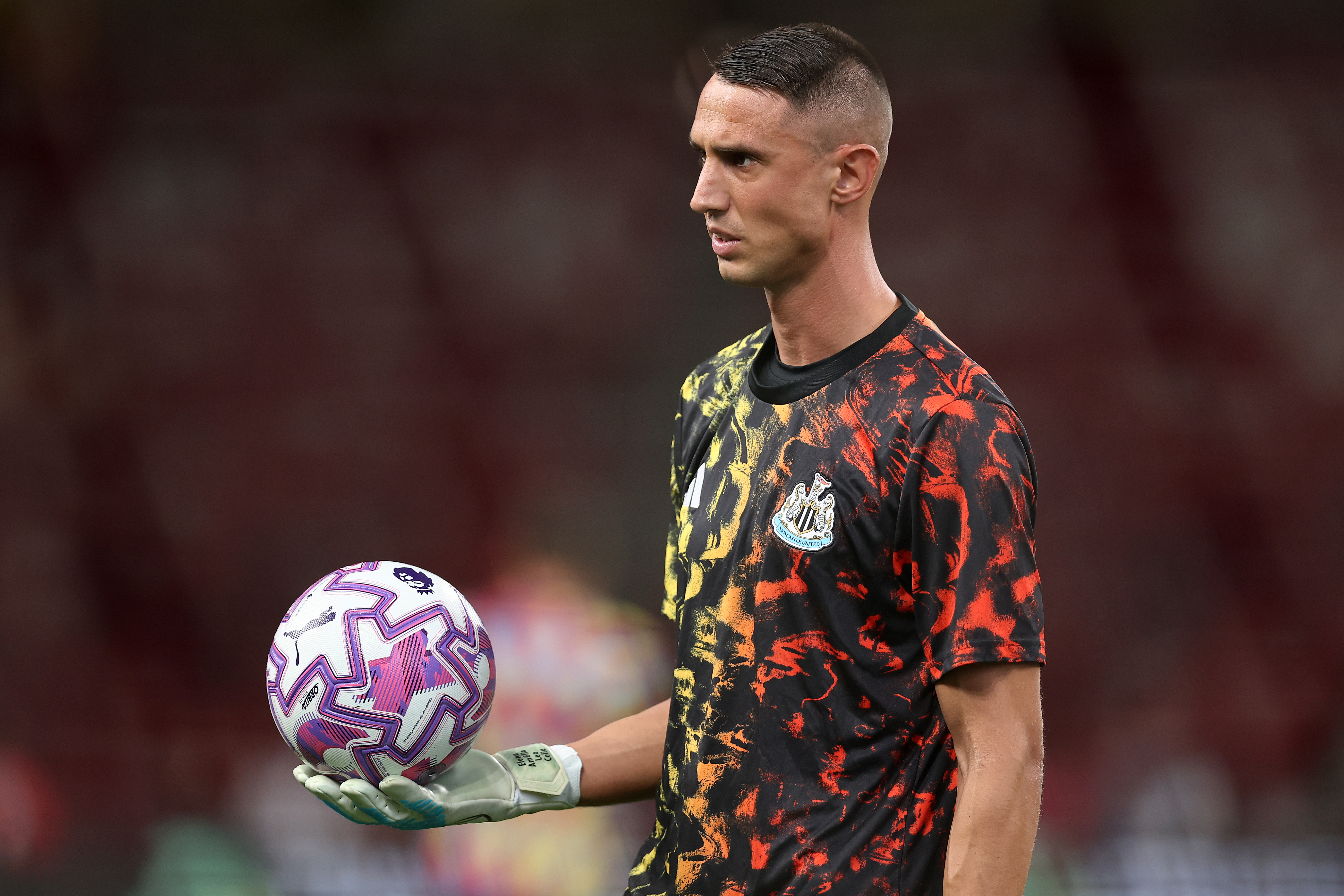 Odysseas Vlachodimos of Newcastle United warms up prior to the Pre-Season Friendly match between Arsenal FC and Newcastle United at National Stadium on July 27, 2025 in Singapore.