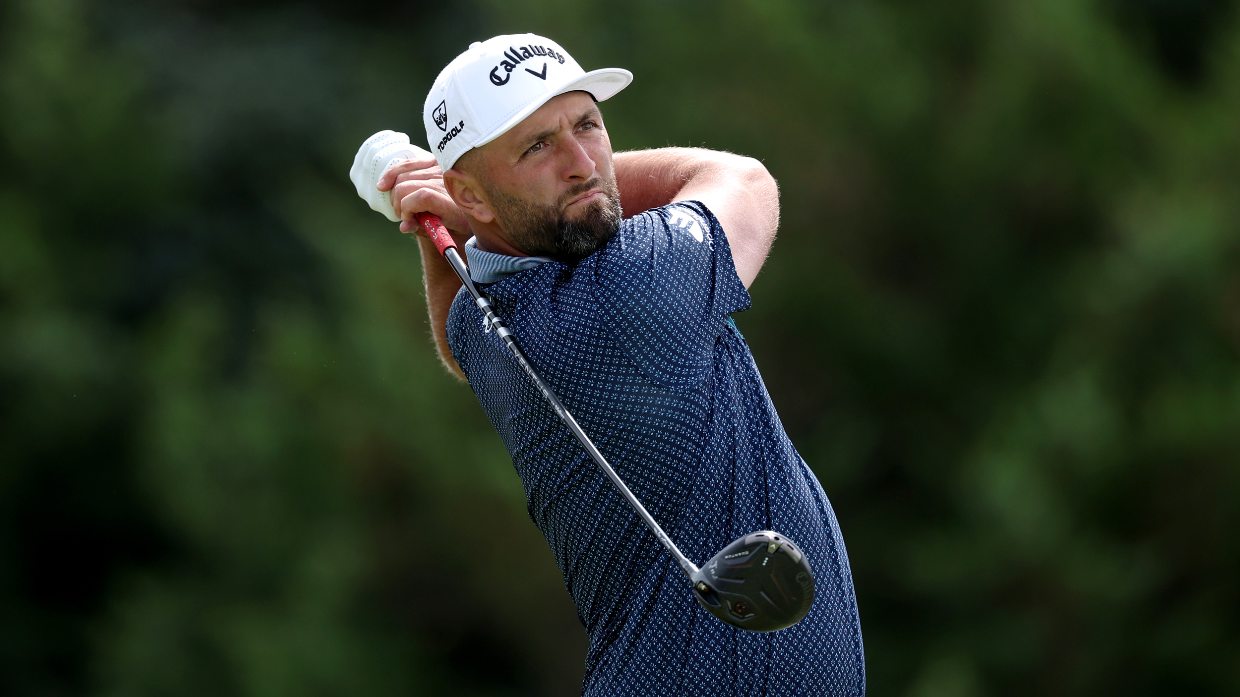 Jon Rahm holds his finish on a drive