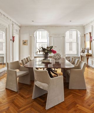 dining room with arched windows beige chairs