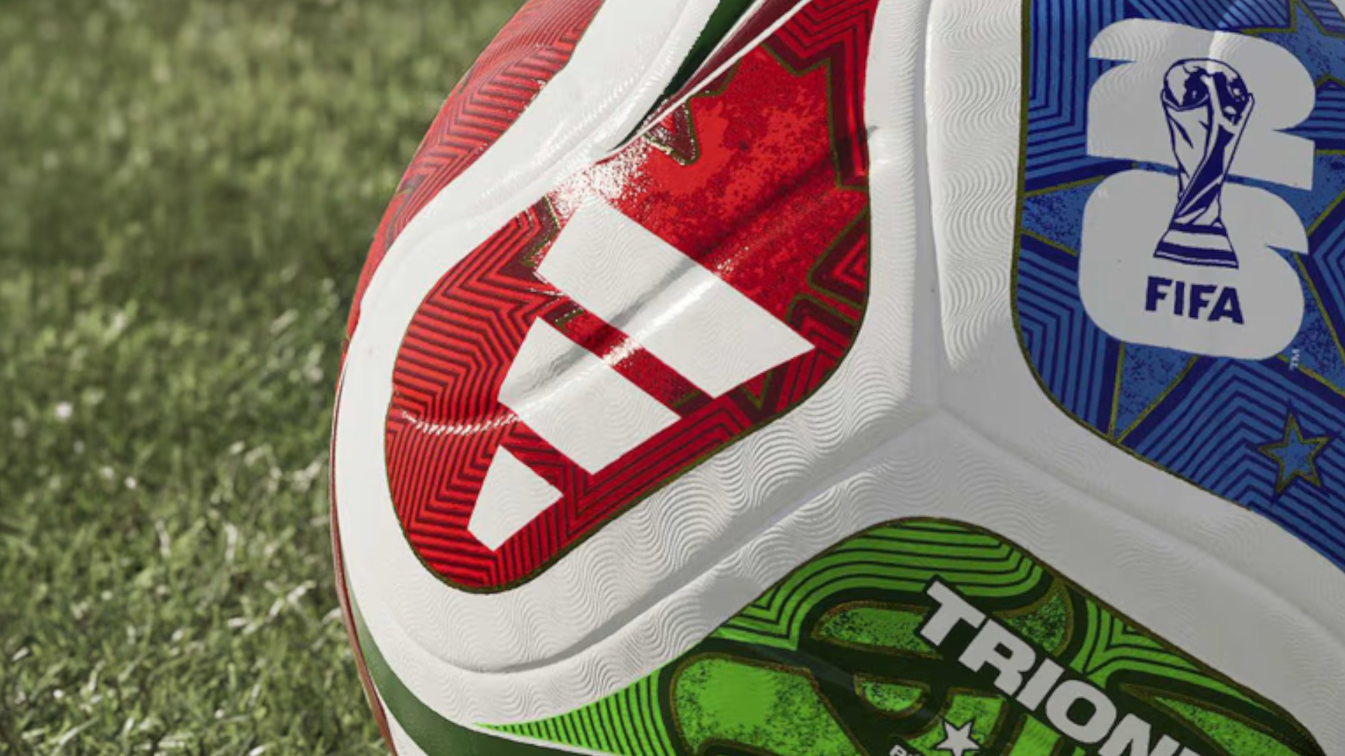 An adidas Fifa World Cup 2026 ball on a grassy pitch