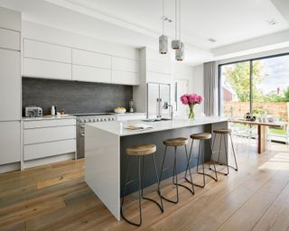 Minimalist kitchen ideas with grey wall and wood floor