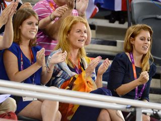 Sarah, Duchess of York, Princess Eugenie and Princess Beatrice applaud from the stands while watching the 2012 Olympics