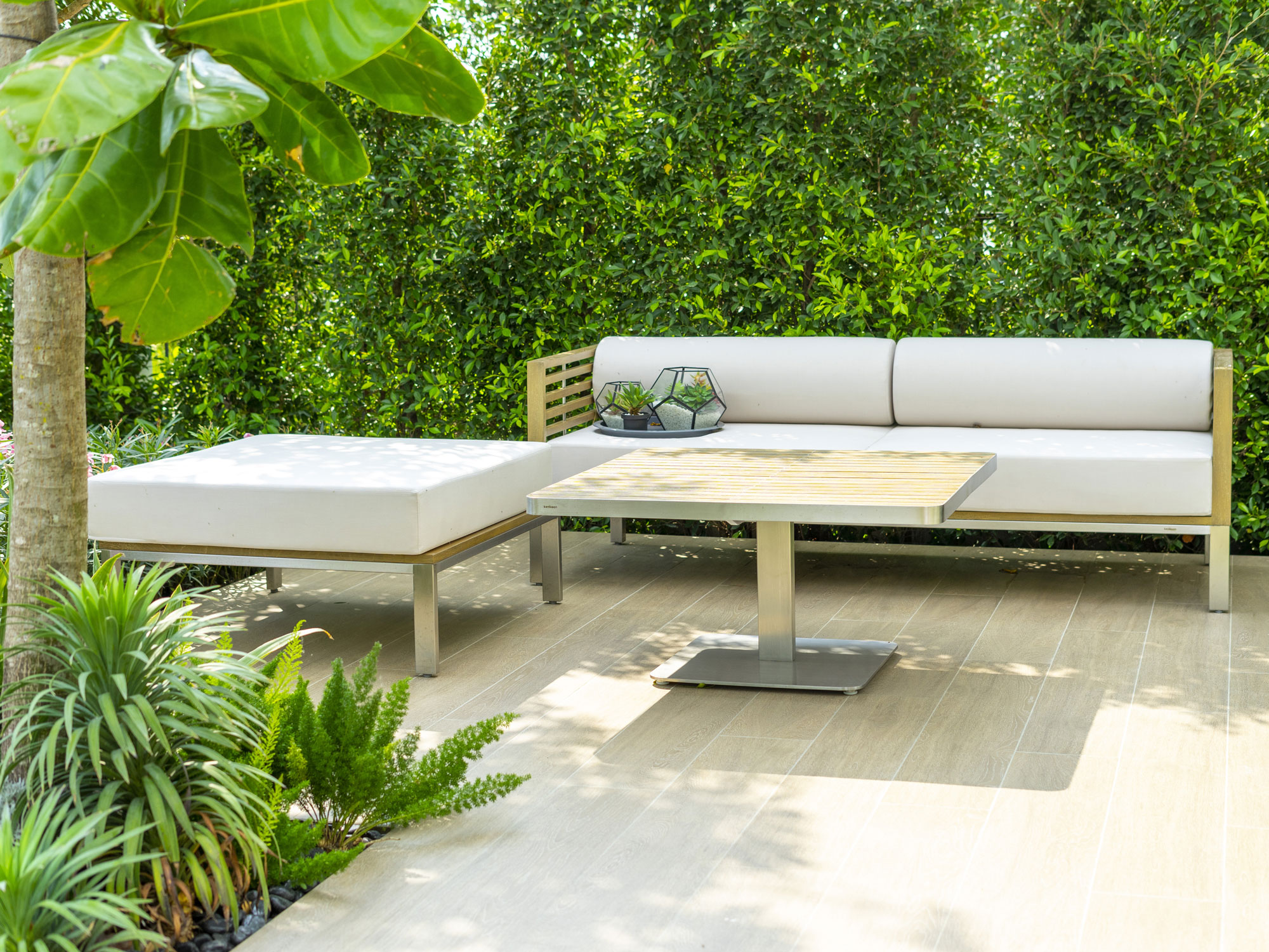 small backyard with furniture and planting