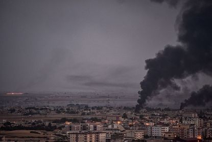 Smoke billows from a Syrian border town.