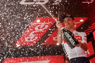 Team Treks Italian rider Giulio Ciccone celebrates on the podium after winning the 15th stage of the Giro dItalia 2022 cycling race 177 kilometers from Rivarolo Canavese Piedmont to Cogne Aosta Valley on May 22 2022 Photo by Luca Bettini AFP Photo by LUCA BETTINIAFP via Getty Images