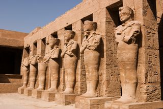 Statues of Ramses II as Osiris in Karnak Temple.